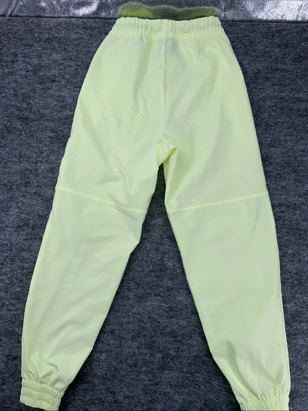 Nike Women's Sportswear Woven Pants in a bright neon green/yellow XS
